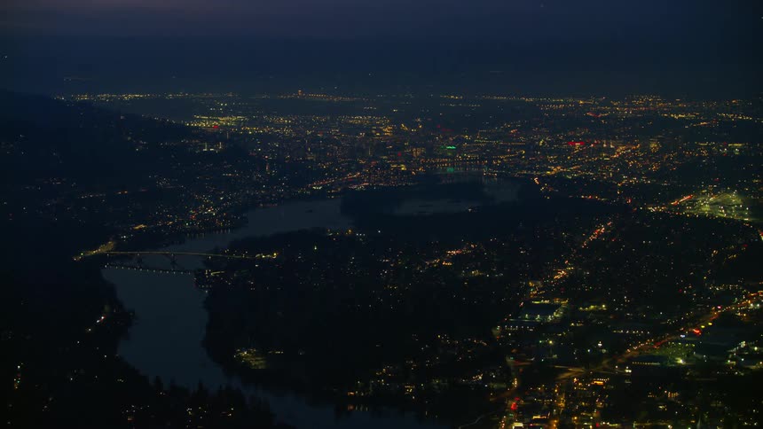 Super wide night blue hour aerial shot of downtown Portland Oregon as seen from the air high above the downtown city landscape