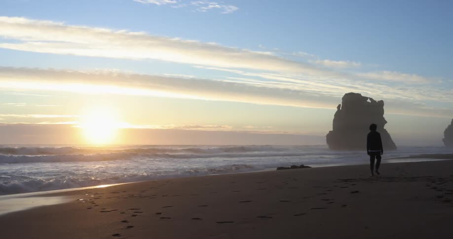 A person walking on a beach