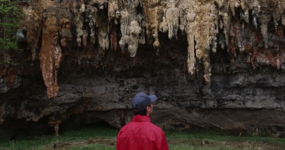 A man takes in an up close view at a canyon