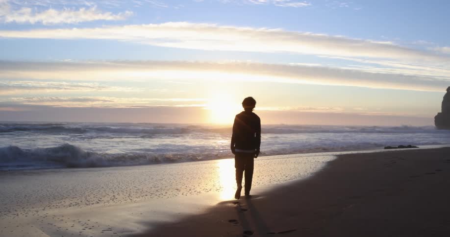 A person walking at the beach