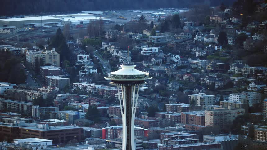 The Seattle Space Needle rises high above the Queen Anne and North Queen Anne neighborhoods in downtown Seattle on a crisp and beautiful night
