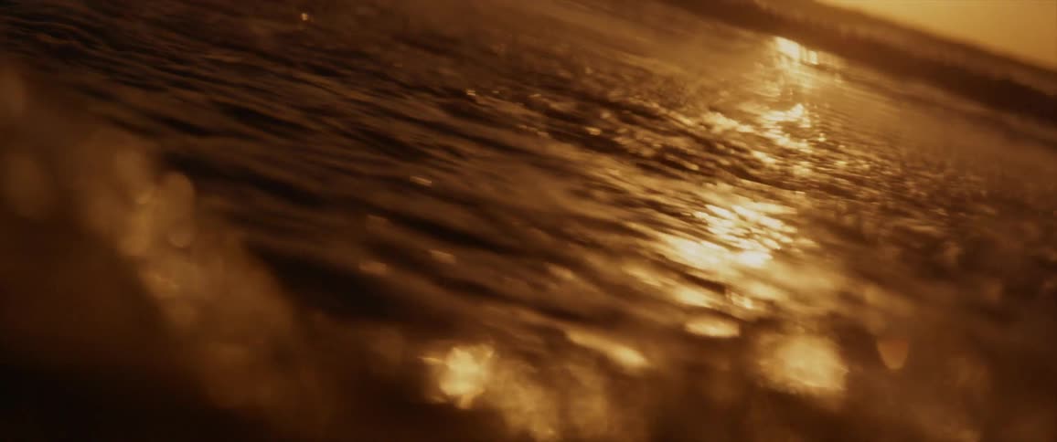 A view of a camera flying above the water in the ocean
