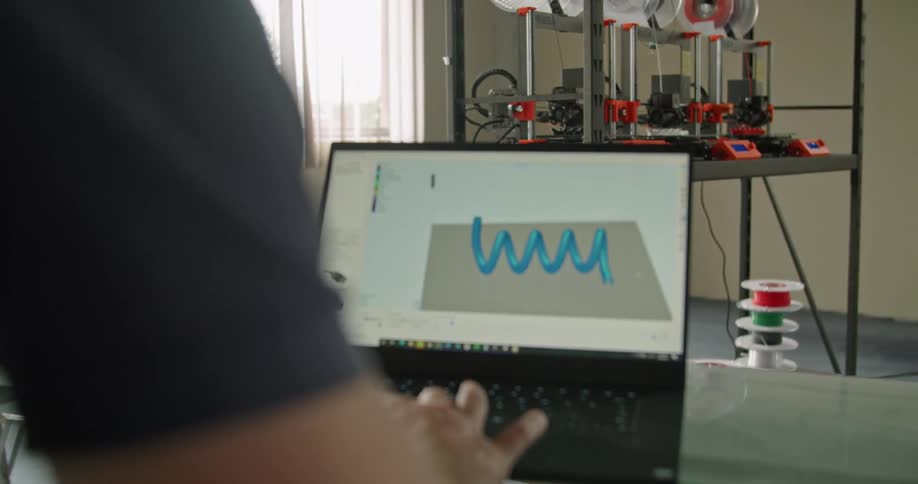 An employee designing something on a computer