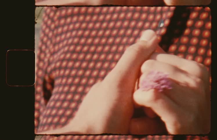 A man puts a flower ring on a womans finger