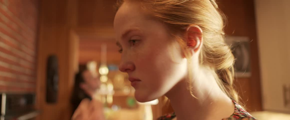 A woman is crying in the kitchen