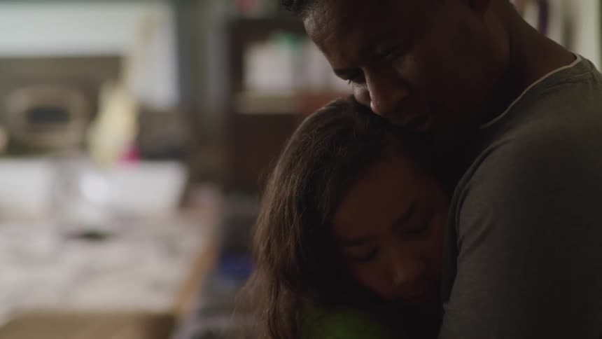 A father hugging his daughter