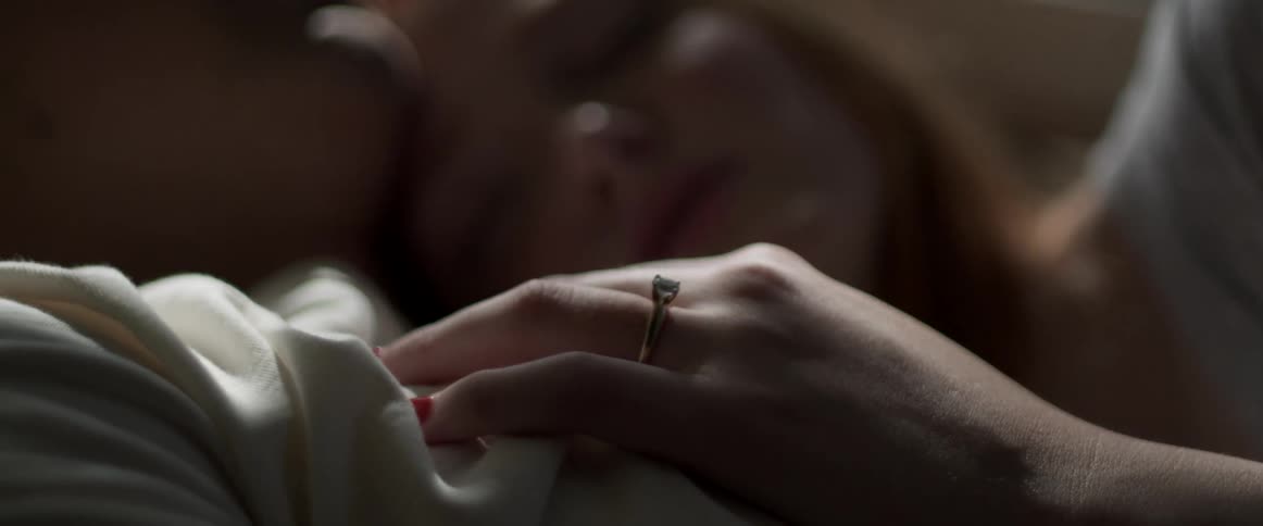 Couple cuddle lying down
