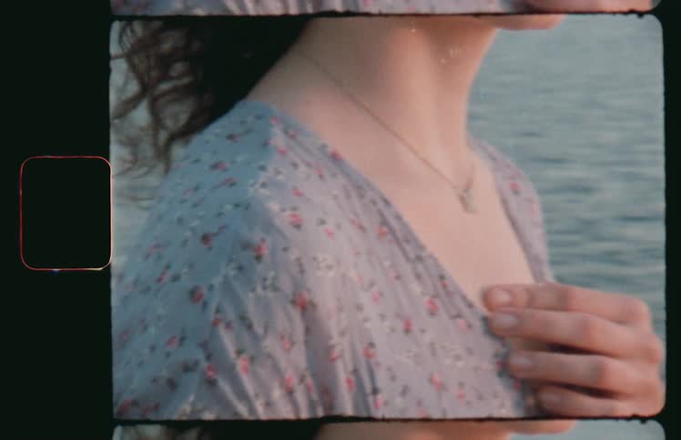 A woman stands on the shore