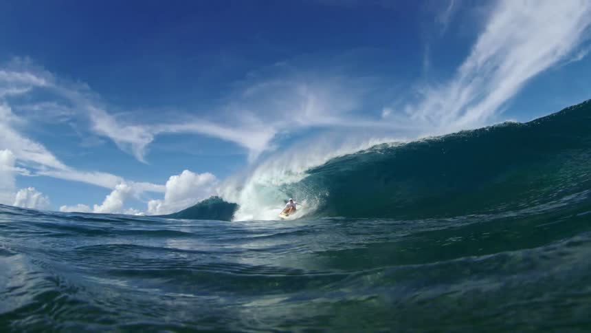 A surfer riding a wave in the ocean