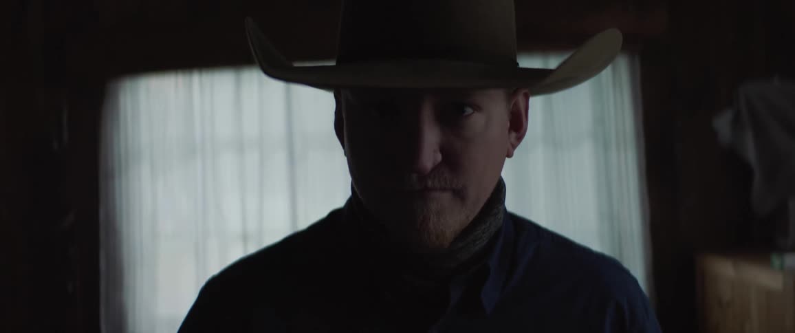 A portrait of a man in a cowboy hat
