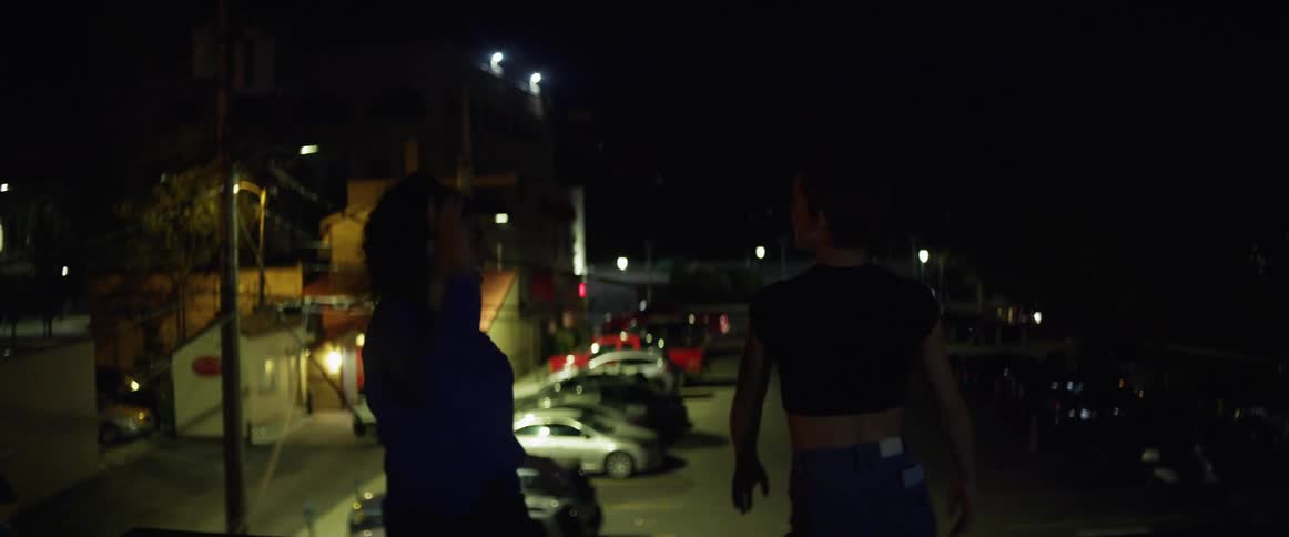Two women dancing on rooftops