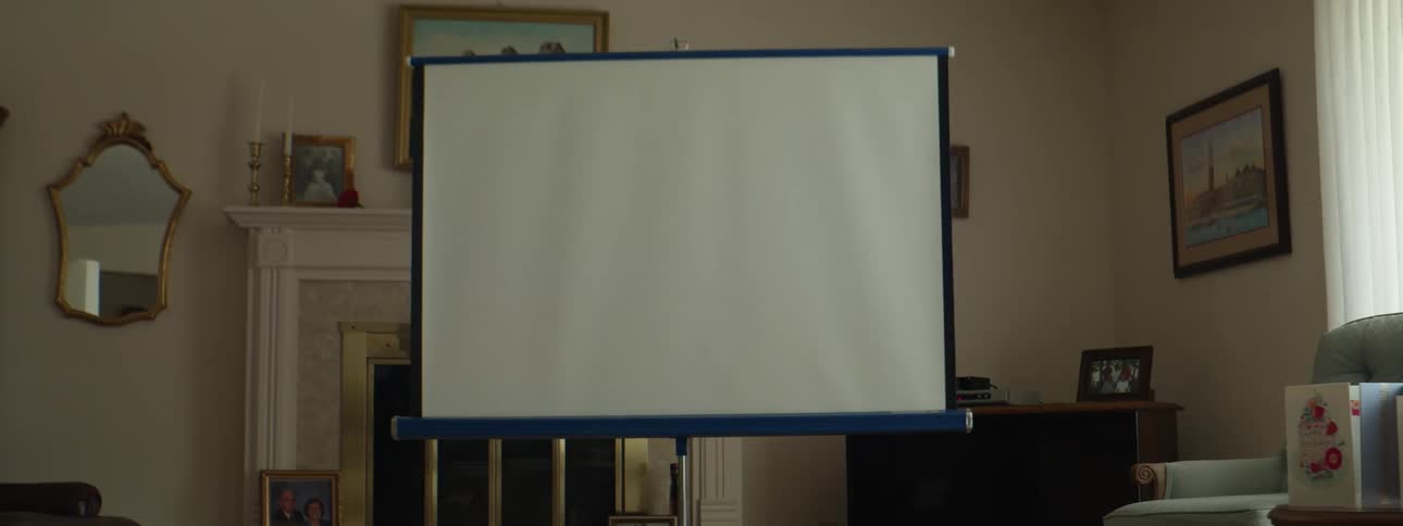 Vintage slides projected on a screen in the living room