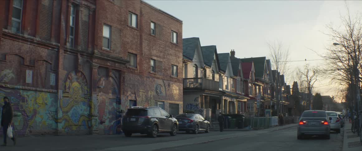 A view of a street in a city at dawn