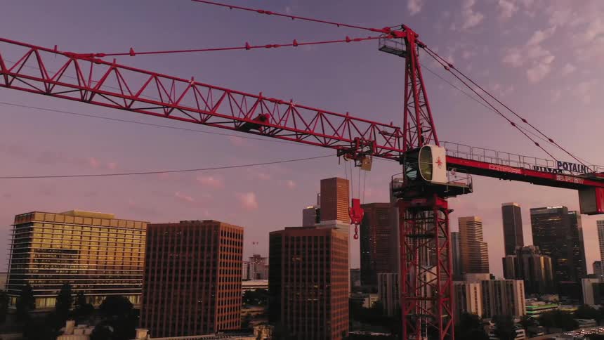 A view of a crane in front of a skyline
