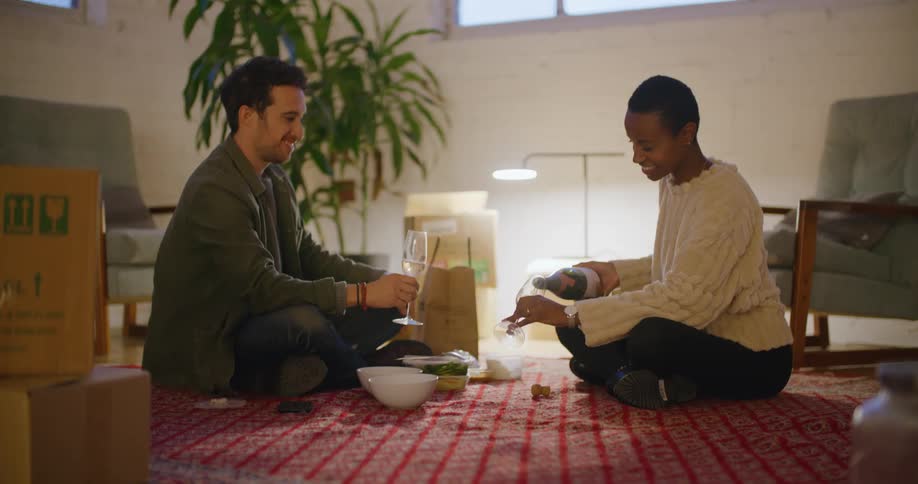A man and woman drinking wine