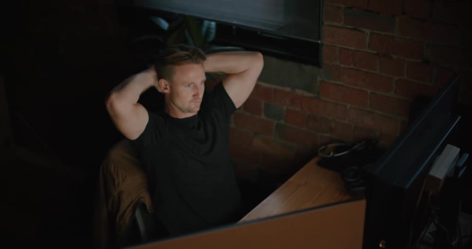 A man working at an office with a computer