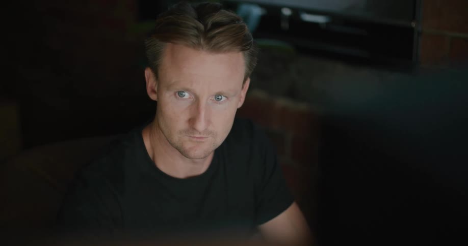 Man works in office on computer after hours