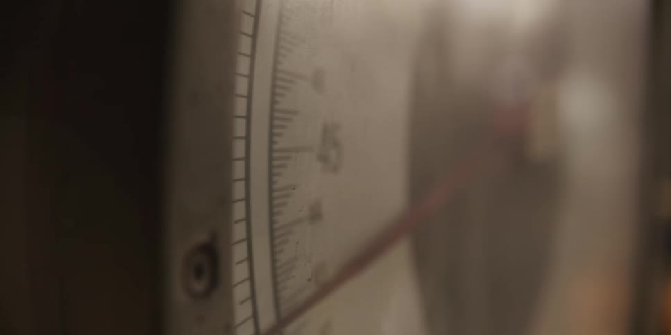 Needle rotates across meter display as value increases