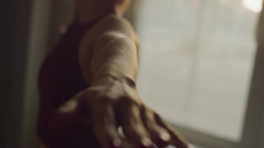 A woman stretches as she exercises