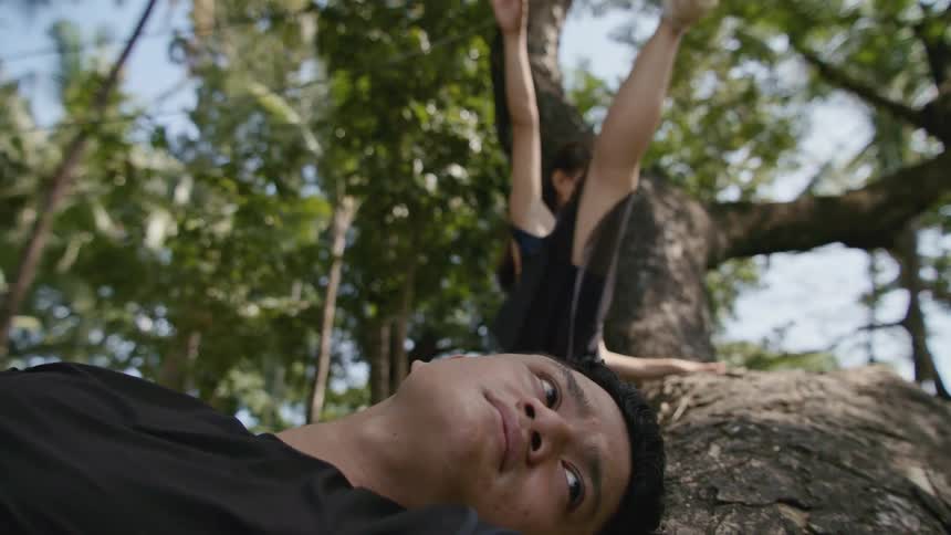 A female dancer lifting her leg while dancing outside