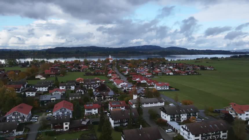 An aerial view of homes in a neighborhood near a river