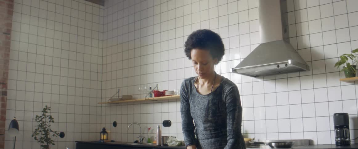 A woman cooks in her kitchen at home