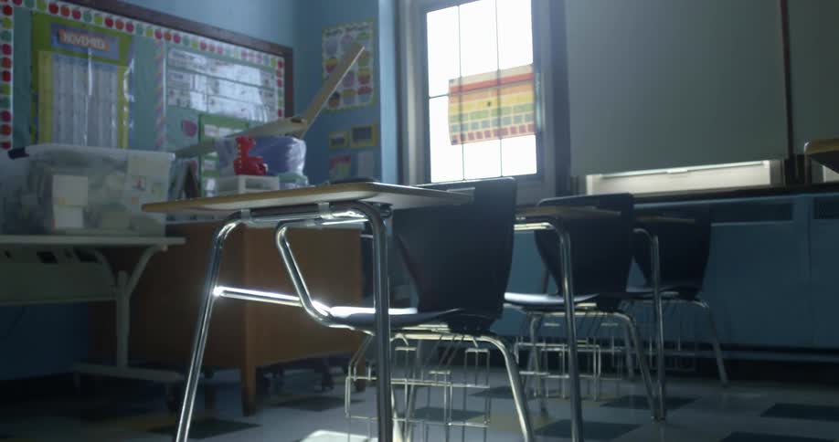 Empty classroom with desks and chairs