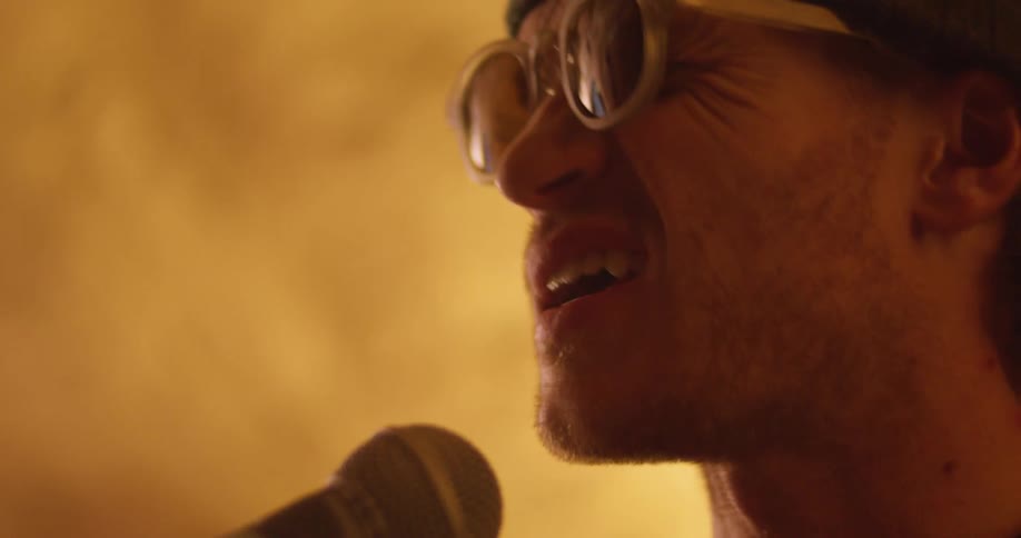 A man singing into a microphone