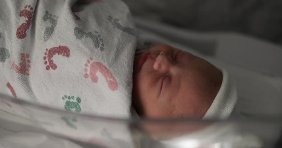 A baby sleeping in a nursery