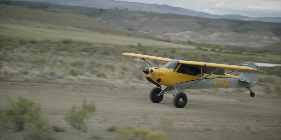A plane moves down the field
