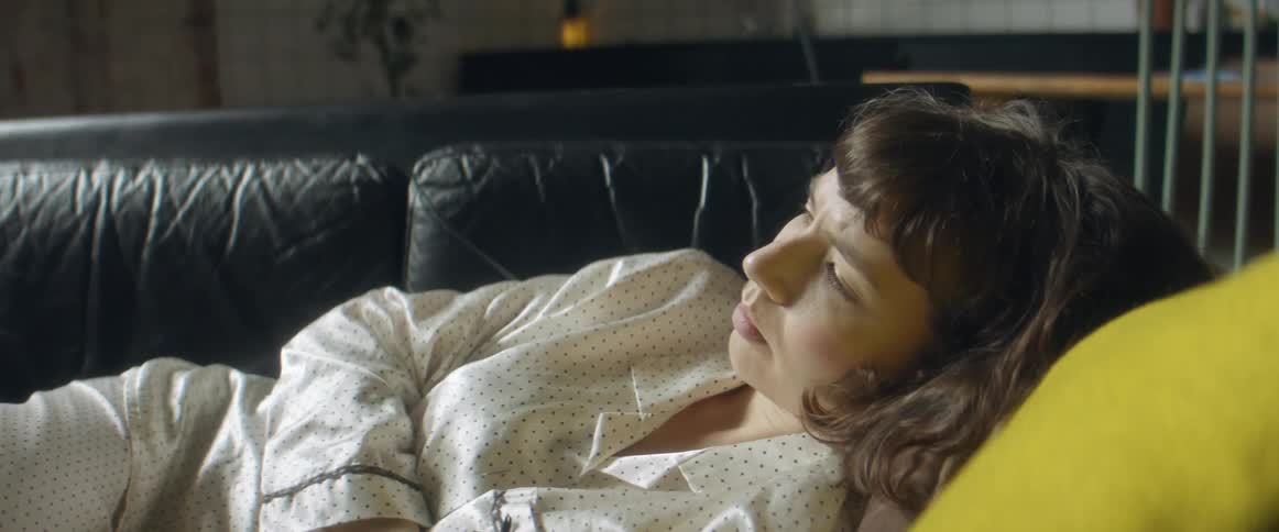 A woman napping on a couch