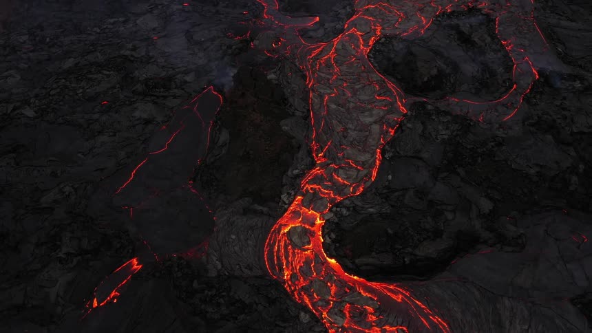 The ground with molten lava smoke and rocks