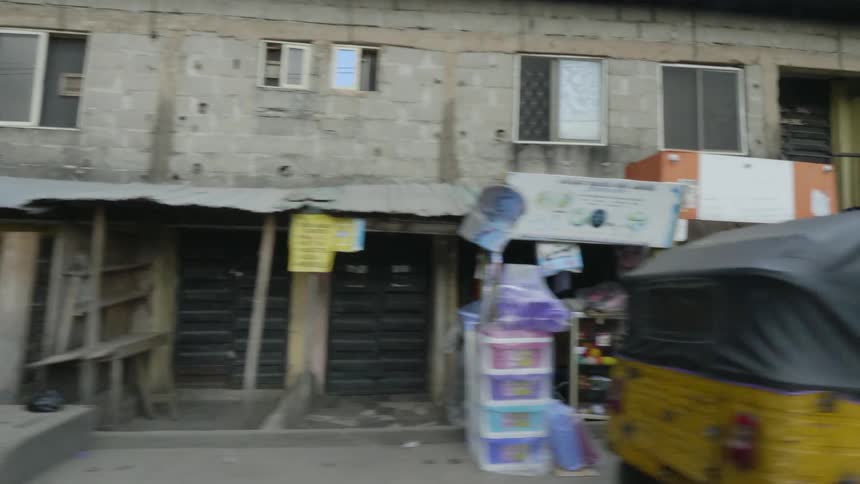 A view driving down a road in a third world nation