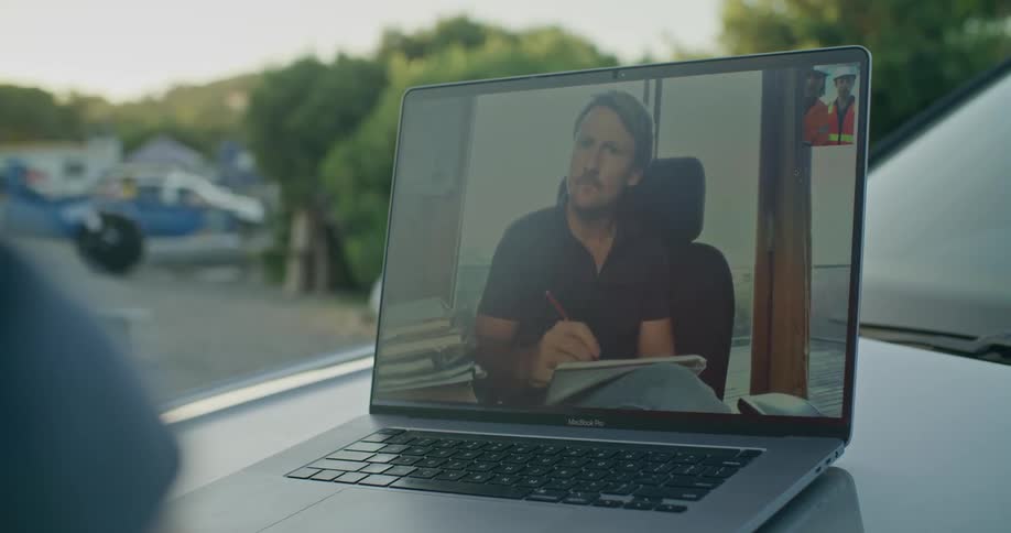 A man that is on a laptop