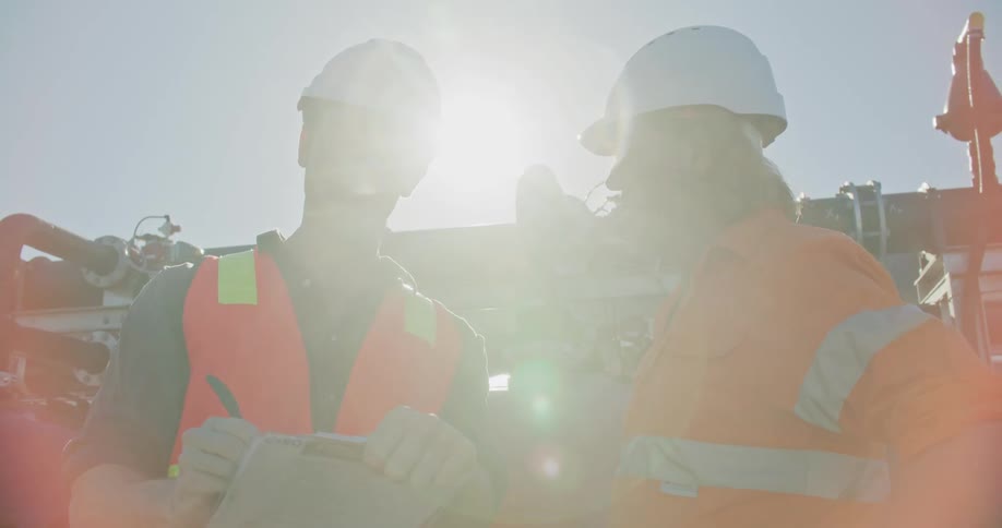Two construction workers talking together