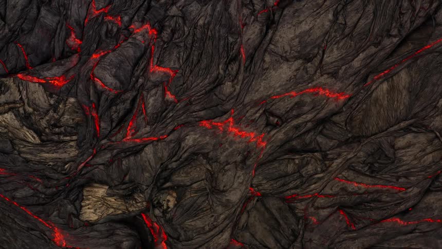 Red lava shows through gray top layer