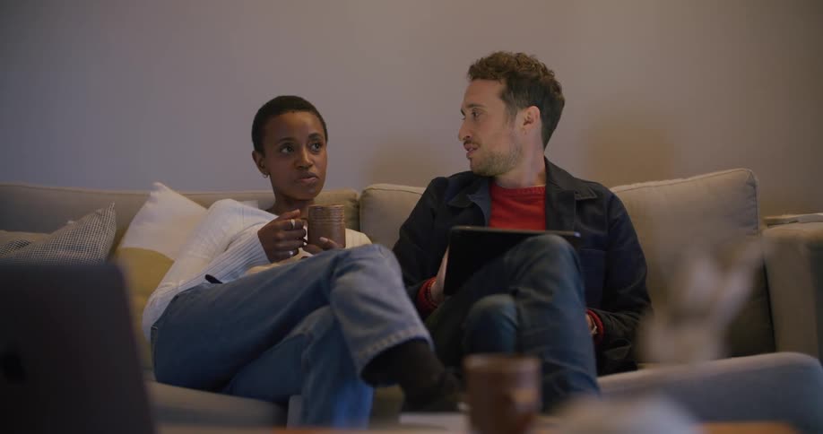 Two friends are sitting on a couch together
