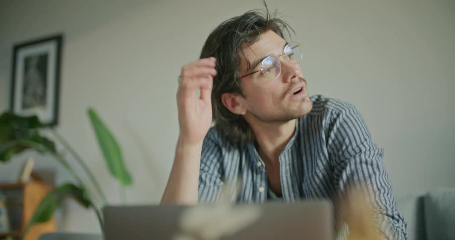 Man using laptop and thinking about his work