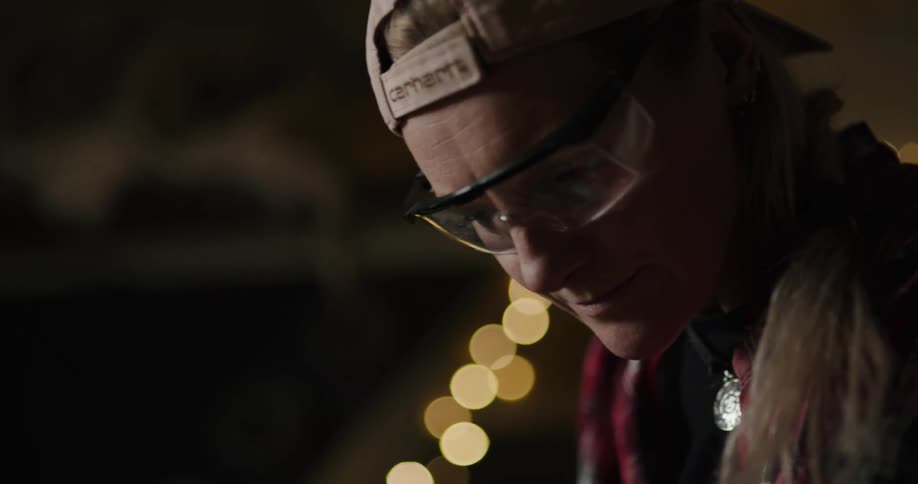 An employee working on wood in a shop