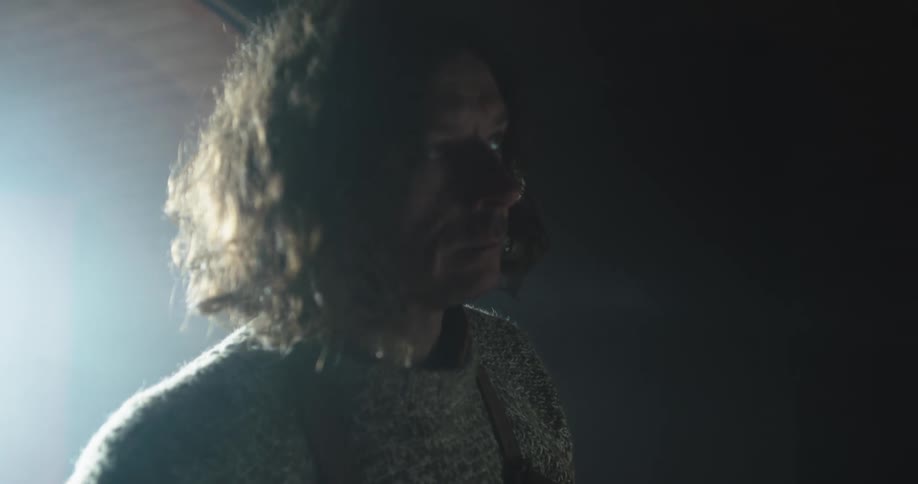 A man walking into a room