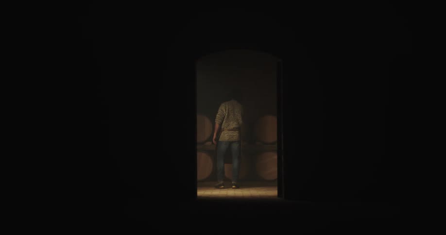 A silhouette of a man walks down a hallway and approaches barrels stacked on top of each other in a room