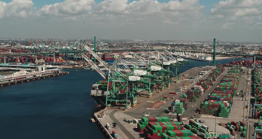 An aerial view of shipping containers on a shore