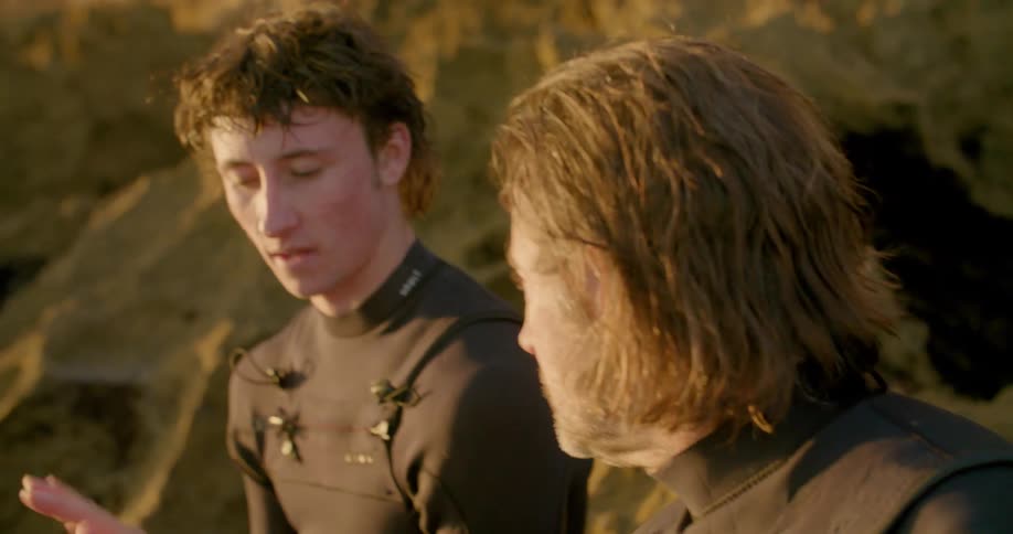 Two men talking to each other outside