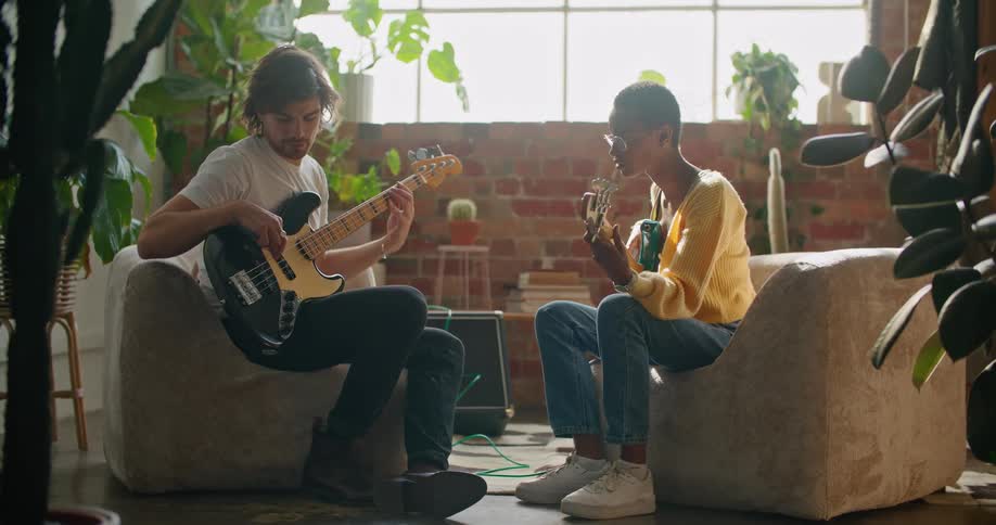 A person is having a music lesson on the guitar