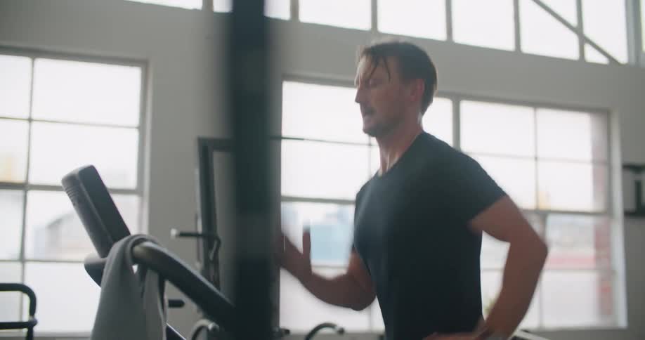 A man that is running on a treadmill