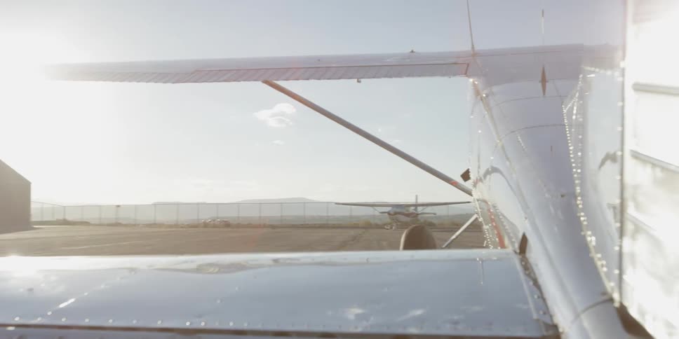 A planes propeller stops and the door opens