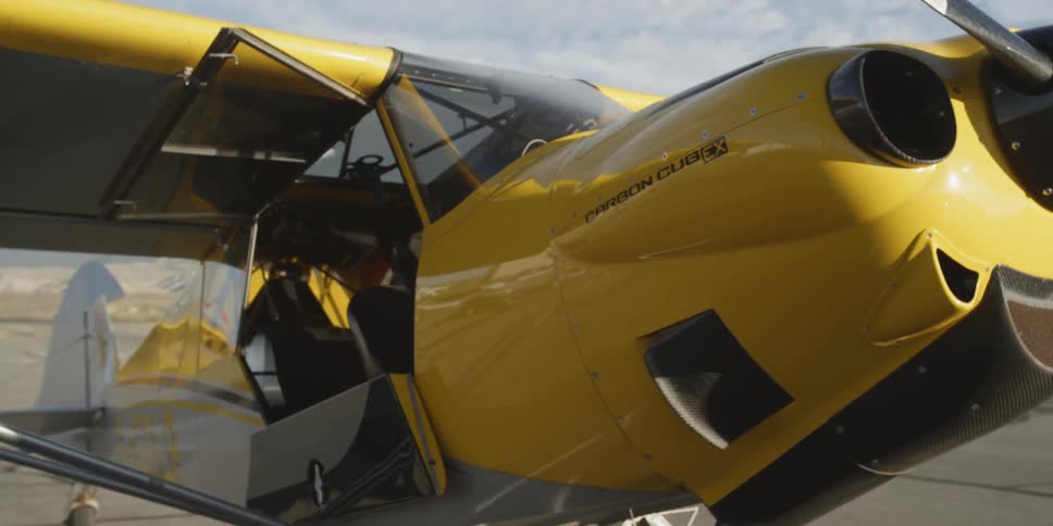 Panning around a parked yellow plane