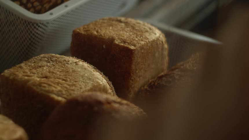 Buns sitting on a counter in a market