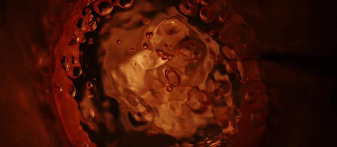 Liquid bubbling inside a cylindrical metallic container