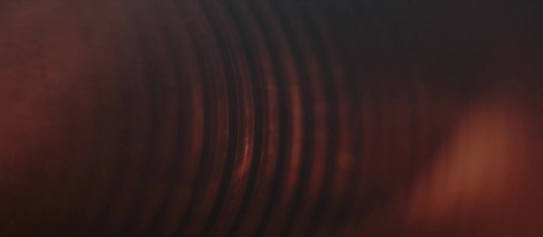 Orange black and gray colors that look like smoke in a tube